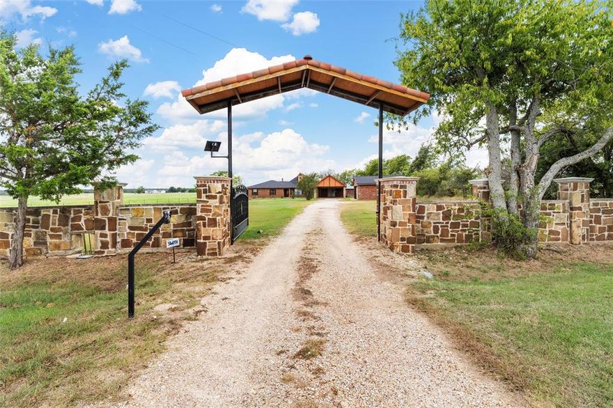 If you are ready for more space, fresh air, & the peace of country living without giving up comfort or convenience, this beautifully updated home in West, Texas is waiting for you. With just under 2 fully fenced & gated acres, there is plenty of room to stretch out. The 3,812 square feet include 4 bedrooms, 2 full bathrooms, 1 half bath, & updates throughout. Fresh paint in neutral colors & hard floors for easy care. The kitchen offers generous cabinetry, granite countertops, & quality finishes that make it a joy to spend time in. The oversized bonus room is perfect for hosting friends & family. It includes a built-in bar & hot tub hookups, making it an ideal space for fun & relaxation. There is a 3-car garage, a large carport, & multiple storage sheds, giving you room for vehicles, tools, & hobbies. The concrete slab is ready for a shop, barn, or whatever you have been imagining. Practical updates such as 2 water heaters, newer air conditioning units, & a recently replaced roof & appliances give you peace of mind from the start. Located in the highly rated West ISD, this property offers the charm of a small town with easy access to everything you need. Come see this special home for yourself & picture the life you could enjoy here.