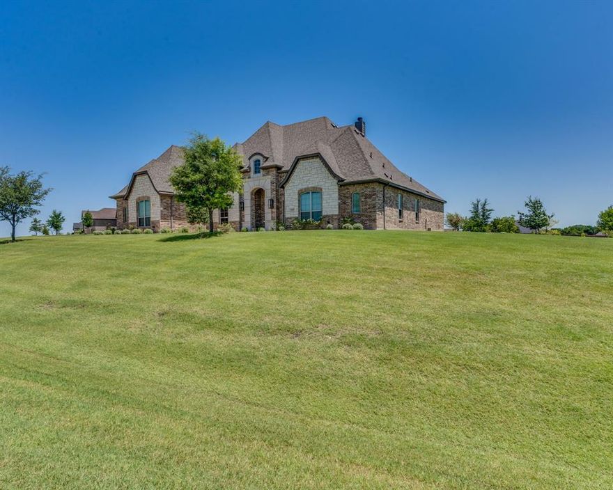 Highly sought MIDLOTHIAN ISD and NO CITY TAXES. Cast Stone Framed Entry welcomes you into this custom single story property on 1.69 acres. Truly Open Concept, the Kitchen and Living Room are the heart of this property. The living room features tall ceilings, custom built ins, and wood burning fireplace open to the huge kitchen with an oversized island. The primary suite located on the Northeast Wing of the Property dual vanities, garden tub, walk-in closet with access to the laundry room. Split Bedroom Floorplan, the other 3 large bedrooms plus gameroom are on the south wing of the property. Retreat to the East Facing Covered Patio and enjoy the view and privacy next to your second woodburning fireplace.  SMART HOME FEATURES INCLUDE security cameras, climate control, dual pane windows, garage door and entry door.  Do Texas Rolling Power Outages worry you? This home is equipped with a Honda 13,500 watt whole home Generator in the event you ever need it.