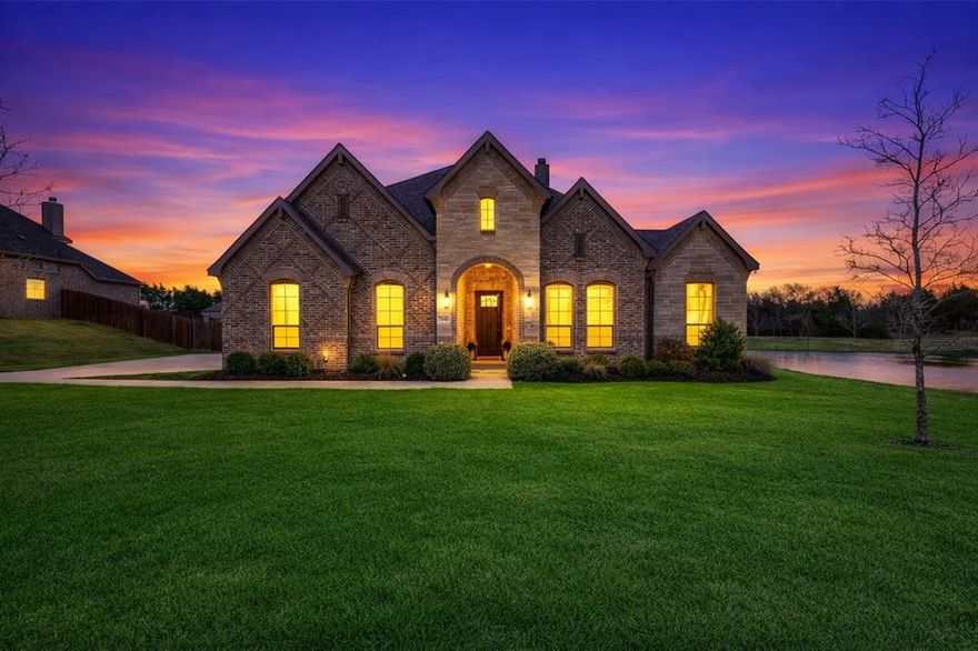 Welcome to the desirable Bryson Manor community in Ovilla, where this beautiful home sits on one of the premier lots in the neighborhood, offering scenic views of the landscaped pond and pavilion. Located within Midlothian ISD and zoned for Heritage High School, this property perfectly blends location, style, and comfort. This John Houston–built open-concept home has been thoughtfully updated and truly stands out. Recent improvements include upgraded light fixtures throughout, custom trim work, fresh interior paint, updated mirrors, and ceiling fans, creating a polished and inviting atmosphere. The study is a showpiece, featuring custom-built-in shelving, decorative trim, shiplap accents, and designer paint with a color-drenching detail. Large windows fill the family room with natural light, creating a bright and welcoming space. The open kitchen is ideal for entertaining, highlighted by a massive center island with breakfast bar seating, quartz countertops, and a spacious walk-in pantry. The adjoining dining area offers beautiful backyard views and plenty of room for gatherings. The primary suite serves as a private retreat, featuring a spa-inspired bath with a walk-in shower, garden tub, dual vanities, and a large walk-in closet. Upstairs, you will find a flexible bonus space perfect for a game room or media room, along with a convenient half bath. Step outside onto the large 18x13 ft covered patio, where you can relax and enjoy peaceful views of the pond and nearby walking trails. Bryson Manor residents enjoy wonderful neighborhood amenities, including a stocked catch-and-release fishing pond, scenic walking trails, and a pavilion with picnic tables, all while benefiting from some of the lowest HOA fees in the area. Conveniently located near Highways 287, 35, and 67, this home offers easy access to Cedar Hill, Waxahachie, and Mansfield, along with convenient commutes to Dallas and Fort Worth. See updates & improvements document attached, too much to list!
