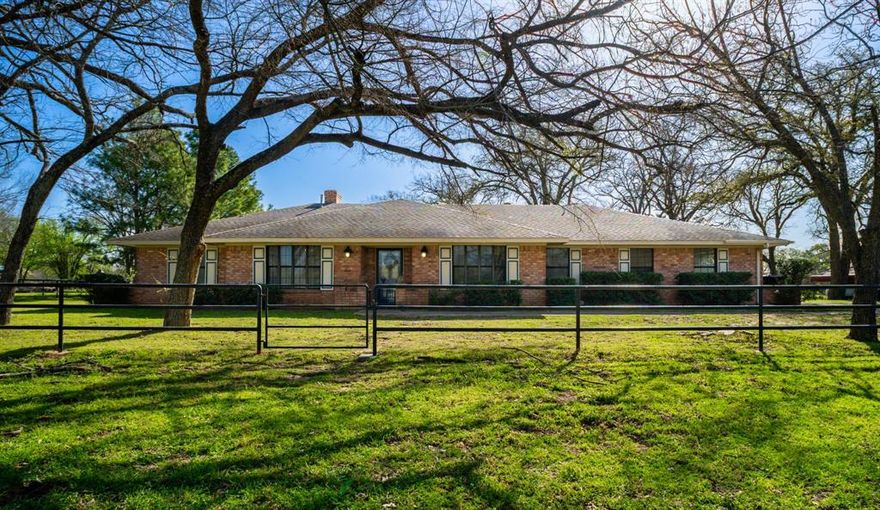 GREAT LOCATION AND BEAUTIFUL SETTING FOR THIS BRICK HOME ON 9+ ACRES IN LIMESTONE COUNTY!! 
What a fabulous property for your next home! This Brick 3 bedroom, 2 bath home with Office and Efficiency Apartment under a NEW ROOF sits on 9+ acres (new survey) with tank, metal piped corrals with chute, fencing and great location. The Homeowner has lovingly taken care of the property for years. Inside you will find an inviting Family Room with vaulted ceiling and gas log fireplace, great views of the acreage from lots of windows that let in natural light, tons of storage and built-ins, 2 Dining areas: Formal Dining Room and Breakfast area, Kitchen with lots of cabinets, appliances, built-in Hutch and special warming shelf over the Range; an Office which could be used as a 4th bedroom, 2 CHA and 2 water heaters, stained and troweled concrete floors that give the home great character, NEW ROOF is installed, and an Apartment or Mother-In-Law suite which is perfect for Guests or an older child who has moved home. This home also boasts a 2 car garage, 2 large patios for outdoor grilling or sitting and relaxing while you enjoy the gorgeous views and nature, pastures, trees and more! The acreage is in Ag Exemption with well water to use for a garden or animals and also on Whiterock Water Supply. Outside you will find a wonderful sized yard for family entertaining, great grazing pastures for your animals, large tank, fencing, and metal piped corrals with built in chute - what more could you want in a property!! This property is located on a County Road off Hwy 14 where it is quiet and surrounding neighbors also have acreage. Please call today for you appointment to tour this lovely home. It's what you have been waiting for! Property being sold AS IS and is in Mexia ISD. Furniture is negotiable.