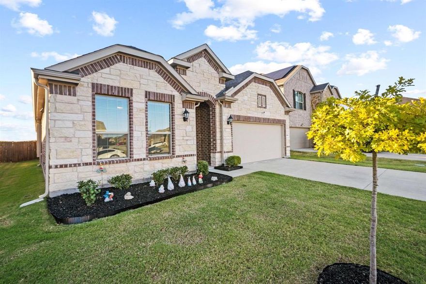 Like New Lennar Rosso Floor Plan! This stunning 4-bedroom, 3-bath home offers modern style, functionality, and comfort all in one exceptional package. Featuring wood-look tile flooring throughout the main living areas, plush carpet in bedrooms, and neutral designer tones, this home is truly move-in ready. The open-concept layout creates a seamless flow between the spacious living room, complete with an electric fireplace, and the gourmet kitchen featuring stainless steel appliances, granite countertops, ample cabinetry, and a large island perfect for entertaining or family gatherings. The private primary suite includes an ensuite bath with dual sinks, a separate soaking tub, walk-in shower, and a generous walk-in closet. Split secondary bedrooms offer space and privacy, each with ceiling fans and walk-in closets. Step outside to a large backyard, ideal for outdoor entertaining, gardening, or play. Located in a highly sought-after community, this home perfectly blends modern design, quality craftsmanship, and everyday convenience. Don’t miss your chance to make this beautiful home yours!