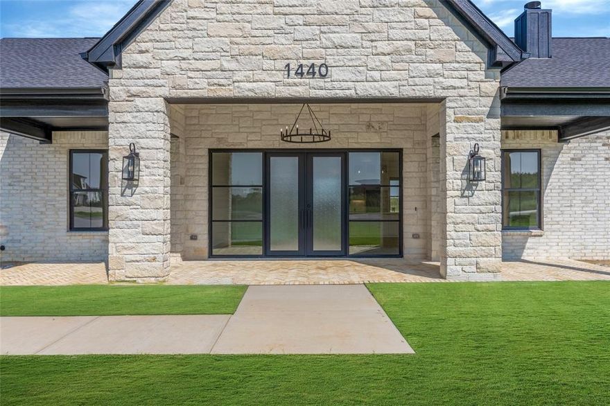 Stunning New Construction on 1 Acre – No HOA!

Experience the perfect blend of luxury and country living in this newly built 3-bedroom, 2.5-bath home situated on a spacious 1-acre lot. Thoughtfully designed with soaring 12-foot ceilings throughout, including the garage, this home offers both comfort and style with high-end finishes and energy-efficient features.

The chef’s kitchen is a true showstopper, featuring a 10’ x 4’ quartz island, full quartz backsplash, pot filler, vented range hood, and under-upper cabinet lighting—all designed for both function and elegance. A large walk-in pantry with under-cabinet lighting ensures ample storage.

Enjoy the seamless flow of natural light through premium black Anderson windows (interior & exterior) and entertain with ease thanks to the black iron & glass sliding patio door and matching iron front door with side glass. The living room and all bedrooms are outfitted with recessed lighting and remote-controlled ceiling fans, with a chic chandelier gracing the front porch.

Outside, you'll love the brick-floored patios in front and back, perfect for relaxing or entertaining. The oversized 2-car garage features an 8-foot insulated door, ideal for taller vehicles or extra storage.

Built with full foam encapsulation for superior energy efficiency and comfort, and equipped with a heat pump HVAC system, this home is designed to save on energy while keeping you comfortable year-round.

All this, with no HOA restrictions, just minutes from the Chisholm Trail Tollway, shopping, and dining—giving you the best of both country charm and city convenience.