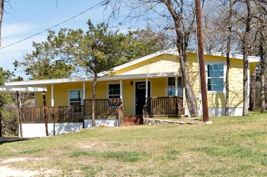 Tucked beneath mature trees in Lake Country Acres, this charming cottage-style home offers peaceful living with room to grow. Situated on two lots, this 3-bedroom, 3-bathroom home combines character, functionality, and endless potential. Step onto the inviting covered front porch — arguably one of the best views around — where you’ll want to pull up a chair and stay awhile. Inside, you’ll find a thoughtfully designed layout featuring three full bathrooms, with two bedrooms offering private ensuite baths, ideal for guests or multigenerational living. The home is well maintained and features laminate flooring throughout and nice updates. Property includes two septic systems, offering flexibility for future additions or expansion. Property includes two septic systems, offering flexibility for future additions or expansion. Outside, a 2-car covered carport adds everyday convenience. If you’ve been looking for charm, space, and flexibility all wrapped into one peaceful setting, this Lake Country Acres gem is ready to welcome you home. Seller will consider owner financing with the right offer!