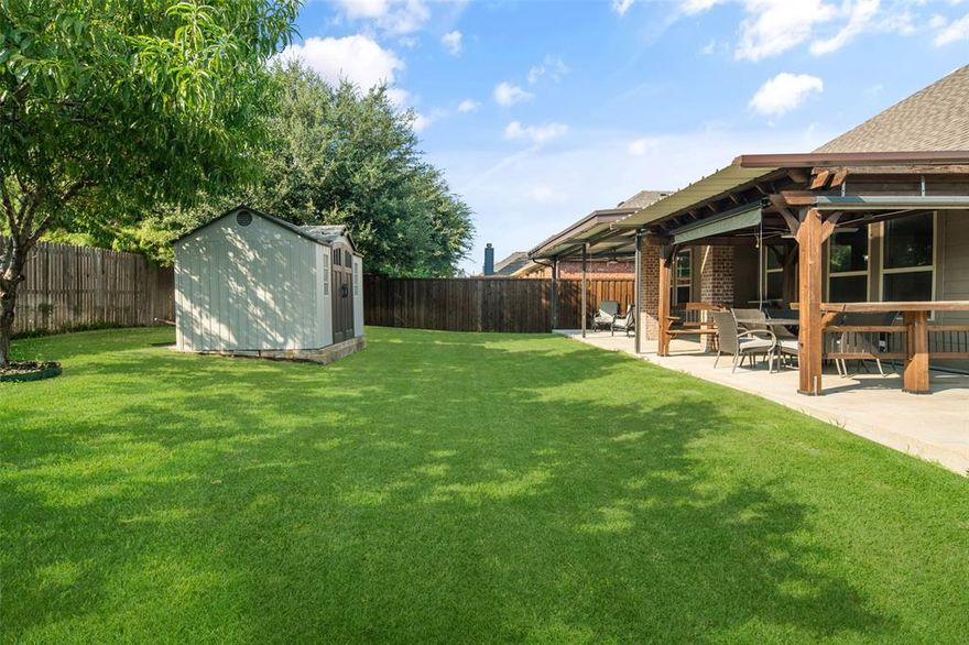 You could be relaxing on this amazing back patio just a few short weeks from now. Beautiful, very clean and well kept, turn-key home with 4 bedrooms, a designated office, and 3 full bathrooms. 3 bedrooms, two bathrooms, plus the office are downstairs. Upstairs is the game room, a full bathroom, and a huge bedroom with a spacious walk-in closet. The master retreat is downstairs. The 2 car garage is 23 feet deep on the right side for an extra long vehicle or extra storage space. The kitchen has granite countertops, gas cooktop, large pantry, and tons of storage. The laundry room has it's own space, so you don't have to walk through it every time you go to the garage. The master retreat has granite countertops, separate shower and soaking tub, and a big walk-in closet.  Enjoy the peach and nectarine trees in the back yard as well! The amazing covered back patio even has gas hookup, 3 fans with lights, solar roll-shades that cover the length of the entire patio, and a very nice shed. Other features and upgrades include a security system, wrought iron stair spindles, ceiling fans in all bedrooms and other rooms, and high ceilings. The cast stone, wood burning fireplace has a gas starter. This home is in Prosper ISD and feeds to highly ranked schools. Also enjoy the community pool, pond, water slides, parks, and green spaces. This location is also great because you can do all the things you need without getting on a highway. Come and tour this home today!