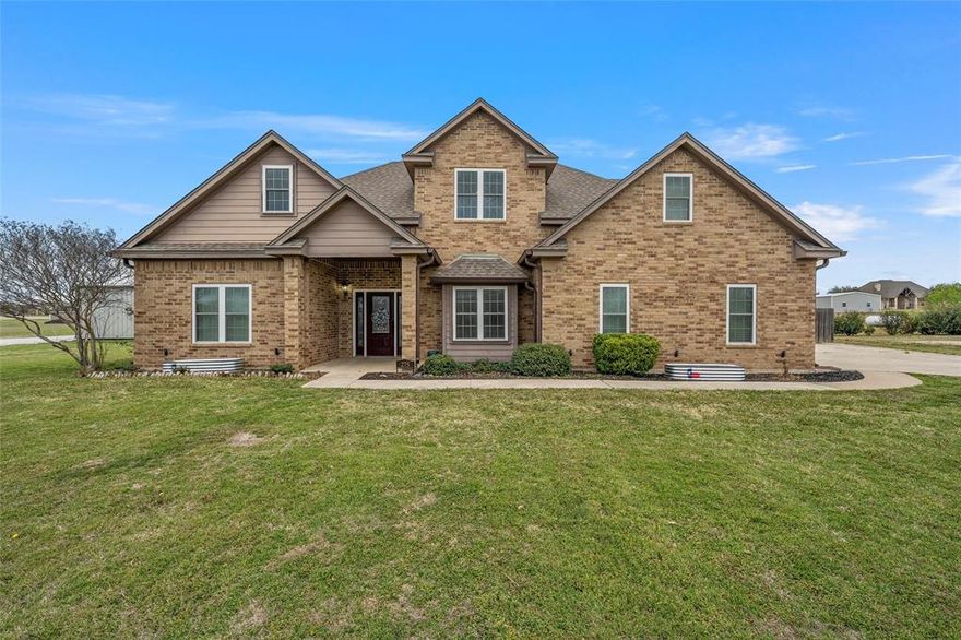 Welcome to your own slice of peaceful country living in the charming and laid-back community of West. Situated on 1.69 acres in the beautiful Quail Run Estates, this stunning property offers the perfect balance of quiet country charm and convenient access to town and IH-35.  With over 2,200 square feet of living space, this spacious home features 4 bedrooms, 2.5 bathrooms, a formal dining room, and a large family room with soaring ceilings and a cozy wood-burning fireplace. Abundant windows throughout fill the home with natural light, creating a warm and inviting atmosphere.
The kitchen is well-appointed with quartz countertops, stainless steel appliances, and direct access to the patio, making it perfect for morning coffee or casual dining.  The isolated primary suite on the main floor provides a relaxing retreat, featuring a large soaking tub, separate shower with subway tile, dual vanities, and an oversized walk-in closet.  Upstairs you’ll find three additional bedrooms along with a versatile bonus room, ideal for a home office, playroom, or flexible living space.  Step outside to enjoy a private fenced backyard complete with a 10' x 12' storage shed and greenhouse, offering plenty of room to relax, garden, or entertain.  Equestrian and hobby enthusiasts will especially appreciate the newly constructed barn (2025) featuring a full 200-amp electrical panel, LED bay lighting with switch, a new driveway to the barn, and new pipe pens with arena.  Located within the highly sought-after West ISD, this well-maintained property offers comfort, space, and country charm in one exceptional home.  Schedule your private showing today to experience everything this beautiful property has to offer.