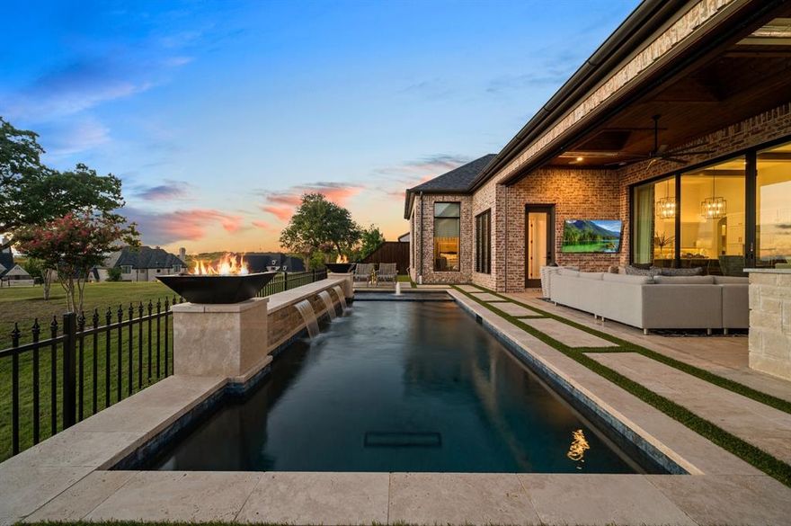 Nestled in the prestigious, gated Normandy Estates, this exquisite French-inspired home occupies a coveted corner lot with breathtaking greenbelt views. The property boasts a luxurious pool and spa, meticulously designed by Riverbend Sandler, complete with a heater and chiller for year-round enjoyment. As you step inside, you are greeted by a grand study and elegant hardwood floors that extend throughout the home. You will notice the attention to detail and designer touches throughout, which you must see to appreciate. The open-concept kitchen and living area offer seamless views of the beautifully landscaped backyard and unparalleled views. A versatile closet space off the entry provides the option for easy conversion into an elevator. Conveniently situated near Highway 121 and the Dallas North Tollway, this residence combines refined, luxury living with prime location access.  Please see attached document with complete list of upgrades.