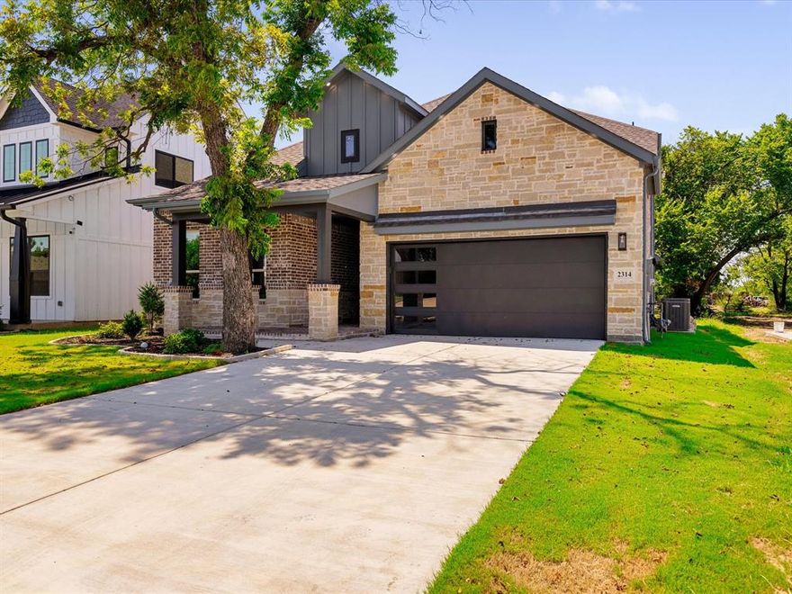 OPEN HOUSE THIS SAT FEB 14 FROM 1 TO 3 PM! Introducing Your Dream Home in Arlington, TX where modern living meets elegant design! A 2925 sqft. custom build, as you step inside, you'll be greeted by a grand entryway showcasing a lovely staircase and beautiful chandeliers. The impressive living room features soaring 20-foot ceilings, a stunning gas fireplace that stretches all the way to the ceiling. The kitchen is a chef's dream, featuring a waterfall island with exquisite quartz countertops that also extend to the backsplash for a seamless look. You'll love the extra counter space, custom cabinets, wine rack, decorative lighting, pot filler and premium appliances included-dishwasher, microwave, gas cooktop, and fridge! This floor plan features a balance arrangement of bedrooms- two upstairs and two downstairs. The spacious master bedroom is a true retreat, complete with a luxurious garden tub, spacious shower, double sinks, gold and black fixtures and a generous walk-in closet. This home has it all, need an office space? Want game room space? Want a media room? You will find all that here! Other features include a tankless water heater, spray foam insulation,2 HVAC units and an irrigation system! Built with pride, come and check it out! Minutes from the Arlington Entertainment district.