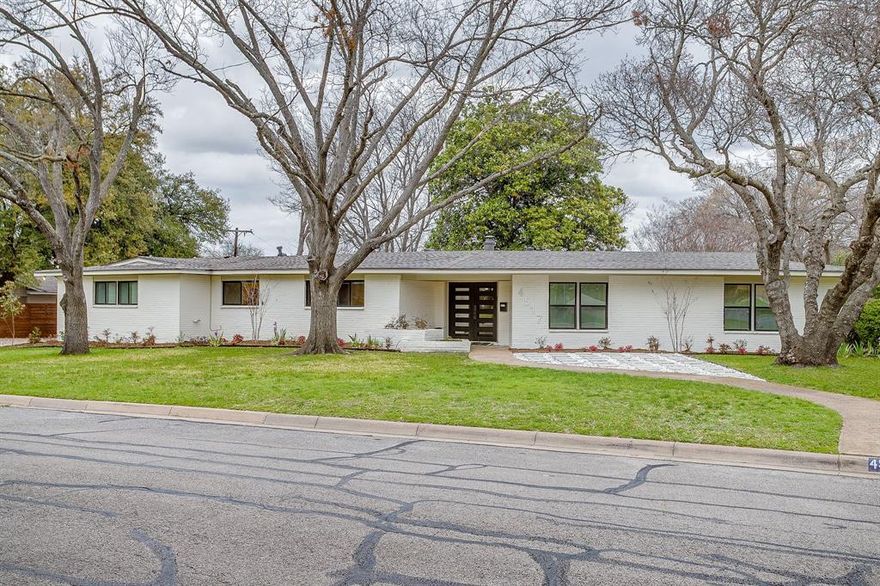 Beautiful sprawling updated 3 bed 2 bath brick ranch-style home on corner lot of cal-de-sac! Perfect family home featuring a large backyard with privacy fencing and large magnolia tree! Step inside onto the stunning hardwood floors in main living areas , primary bedroom and hallways ! Large open living area with multiple windows for tons of natural light . Or relax in the large den flex area  with wood burning fireplace while looking out the  sliding glass  back doors to the your backyard . Fabulous kitchen open to den flex area with eat-in counter and additional breakfast nook area . Kitchen is a chefs dream with stainless steel appliances. Featuring a 6 burner gas cooktop with grill, pot filler, ventahood , dual ovens , dishwasher and pantry!   Additional third large flex room with tile flooring for game-room or home office! Primary bedroom features hardwood floors and en-suite bathroom with double sinks, glass shower with rain shower and handheld sprayer and  a walk in closet. All 3 bedrooms currently accommodating king size beds in each.Separate Walk in full size laundry-utility room with additional closet , built cabinets with countertop .This property has all the charm and sprawling space and backyard of the ranch-style home with all the modern updates, finishes and amenities! NEW Roof and energy efficient windows installed in 2024, New hot water heater and HVAC in 2022!  All of this just waiting for you to call home!