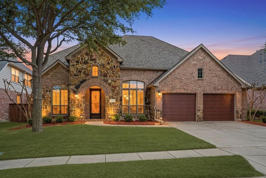 Stonebridge Ranch Home with Lagoon-Style Pool!  Located in sought-after SBRanch, this home stands out with a layout & setting designed for everyday living & entertaining. Step outside to a backyard retreat anchored by a lagoon-style pool with diving board, tanning ledge & multiple water features. A large pergola + extended covered patio create the perfect space for outdoor dining, relaxing, or hosting—offering year-round usability with views of the pool & yard. Inside, soaring ceilings & abundant natural light create an open, inviting feel from the moment you enter. A private study with French doors provides flexibility for work. RigidCore White Ice Luxury Tile Flooring spans the main level, complemented by warm wood accents on the staircase. The living room is centered around a gas fireplace, flowing easily into the main living areas. The oversized primary suite offers space for a sitting area & includes a well-appointed, remodeled sparkling primary bath with dual vanities, a garden tub, frameless shower & generous storage. The kitchen has been recently refreshed with painted cabinetry, stainless steel appliances & updated lighting—functional for daily use + ideal for entertaining. Upstairs, you’ll find three spacious bedrooms along with a large game room & media space. More recent updates include a resurfaced pool + updated equipment, HVAC & windows, providing added value & peace of mind. Stonebridge residents love the community amenities---parks, playgrounds, a community pool, tennis courts, walking paths & membership golf. Offering a unique combination of space, updates & outdoor living, this home is one you won’t want to miss! Ready for New Owners Immediately...Make Your Move to Faraday Today!