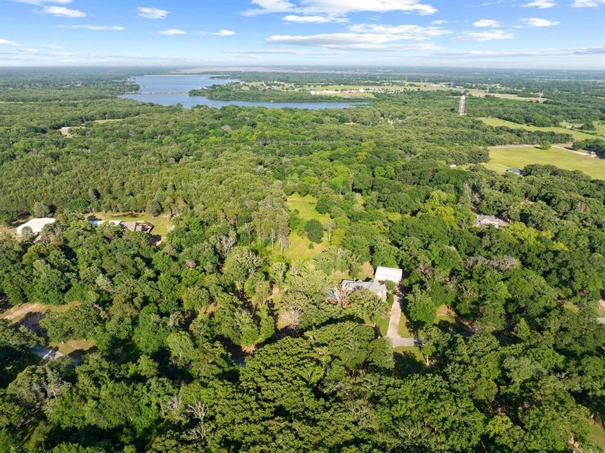 Great opportunity for full-time living, weekend getaway, or investment in northern Texas. This 5.3-acre subdivision tract is located just north of Bonham, right outside the city limits. The property features beautiful, mature trees and a peaceful setting while remaining conveniently located just minutes from Lake Bois d’Arc and Lake Bonham, with easy access to Sherman. A perfect place to build your dream home or hold as a long-term investment. Utilities available. Some restrictions apply.  Buyers verify utility pricing with provider.