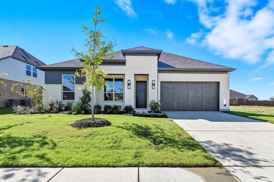 Ask the Sales Team about our exclusive low-interest rate promotions! Discover elevated living in Ridge Crossing, a boutique pocket community where sophistication meets comfort. This exquisite single-story home offers over 2,800 sq. ft. of thoughtfully designed space on a quarter-acre lot. A striking modern exterior welcomes you with light Silverado brick, an Onyx black roof, a covered front porch, and a cedar garage door. Inside, soaring ceilings, light flooring, and a private study set the tone for refined elegance. Each guest bedroom includes an en-suite bath, plus a convenient powder room for visitors. The entertainment room invites movie nights and gatherings, while the heart of the home impresses with a chef-inspired kitchen featuring double ovens, a 5-burner gas cooktop, stacked upper cabinets, a hutch, and backsplash extended to the ceiling. The open dining and family rooms boast 16-foot vaulted ceilings with wood beams, a floor-to-ceiling gas fireplace, and sliding glass doors leading to an extended covered patio, complete with a gas line for grilling. Retreat to the secluded primary suite, offering a spa-like bath with a soaking tub, separate shower with tile pan, dual sinks, and a walk-in closet with ceiling-high storage. Throughout the home, sleek black hardware enhances the modern design, adding a bold, cohesive touch to every room. A spacious utility room is pre-plumbed for a future sink, and the 3-car tandem garage provides ample storage. Experience modern luxury and timeless design...welcome home to Ridge Crossing!