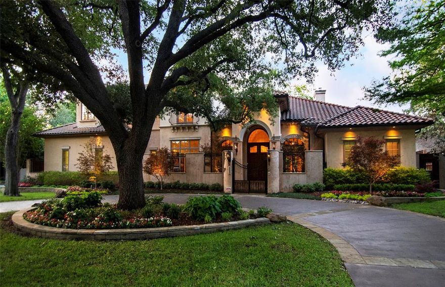 This stunning, soft Santa Barbara styled Mediterranean built by Nixon Custom Homes is situated on a 125 x 150 corner lot in the heart of Preston Hollow! The property is exceptionally landscaped with specimen trees and beautiful plantings highlighted by thoughtful exterior lighting. Quality materials and detail inside and out!  Hard coat stucco, tile roof, copper gutters and downspouts and a gorgeous pool with waterfall.The interior is timeless, featuring Venetian plaster walls, a groin vaulted ceiling in the entry, rustic beams and other charming architectural details. Over sized living areas which flow towards the kitchen and outdoor living areas make it an ideal property for large scale entertaining. The downstairs affords a light filled primary suite which overlooks the lush back gardens and pool area. A split guest suite with ensuite bath, library and exercise room(or 5th bedroom option) are also on the first floor. Upstairs - Two bedrooms, game room and media room!