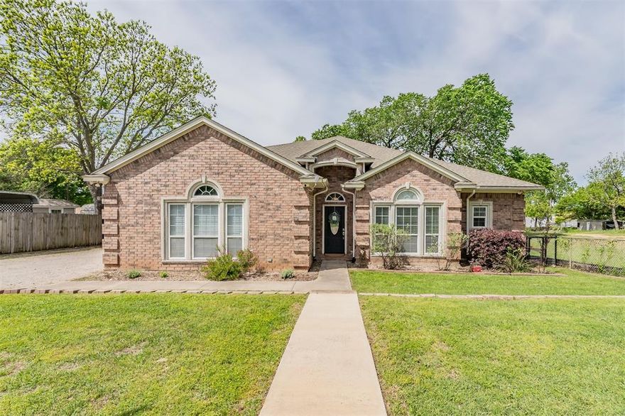 This custom built home showcases waterfront lake living. Pride of ownership is obvious, the home has been maintained and well taken care of. New HVAC units were installed 2023, new glass cooktop Mar 2026, new neutral paint throughout entire home and garage Mar 2026 and the property has an in home water softening system. Open concept floor plan with living, kitchen and dining areas all open with amazing views out to the beautiful back yard and Eagle Mountain Lake! The massive 50'x15' covered back porch is what lake living is all about, it brings indoor outdoor living to life. With access to the porch off the dining room, living room and primary bedroom you can entertain friends and family with an easy laid back flow or you can simply sit and read, nap or watch amazing sunsets over the lake! The back porch looks like a Southern Living Magazine photo and makes this waterfront property even more special. The property also has a workshop, approximately 1000sqft with concrete flooring, plumbing and electric. The shop could be a she shed or man cave or combo, the options are endless. Backyard has a 70'W x 4'D retaining wall at the waters edge. The backyard has a newer constructed 130 ft pier with handrail, LED lighting, with 110 and 220 electric, the perfect addition for those who love to fish. At the waters edge there is ample room if new owner chose to add a boat ramp, there is an existing 2 panel gate installed for a boat ramp. Irrigation pump system for watering front and back yard. This waterfront property has so much to offer, custom home, amazing back porch, a shop, a fishing pier, beautiful yards you need to come and see it for yourself, you may decide to make it your very own!