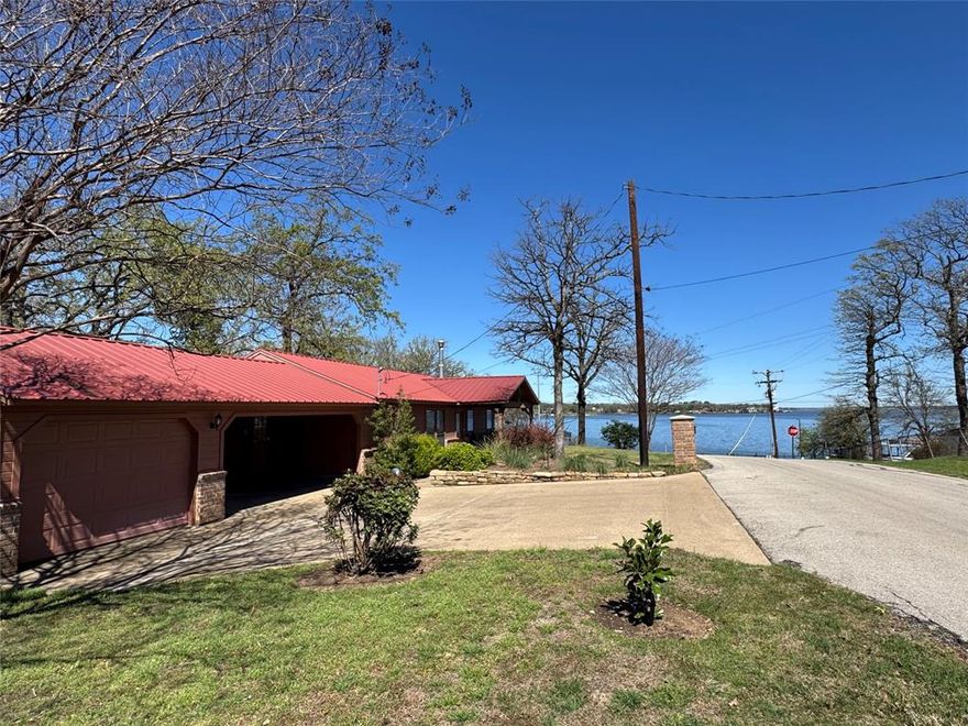 Lake Views, Flexible Space & Easy Access to the Water!
Beautiful lake-view home offering comfort, character, and flexibility for full-time living or the perfect family retreat. This inviting property features rough sawn beamed vaulted ceilings in the living room, energy efficient upgrades, low-E windows, and a cozy wood-burning fireplace that creates a warm, welcoming atmosphere. Granite countertops in the kitchen and baths, along with a walk-in pantry, provide both style and convenience. The durable metal roof adds peace of mind, while the 1-car garage offers excellent versatility as a garage, game room, or possible 3rd bedroom. A 2 car carport provides additional covered parking, and a two porches to enjoy the lake. With beautiful water views and a pier and boat ramp just across the street, this home is ready for weekend escapes or everyday lake living.