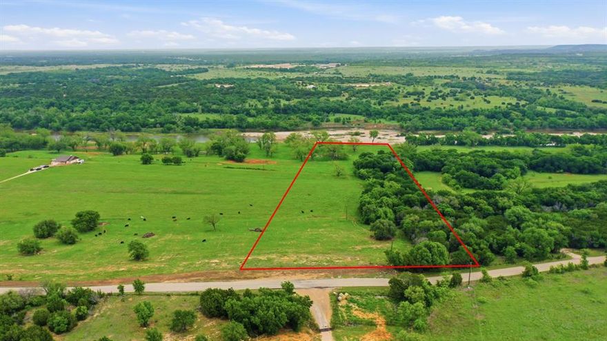 Discover the perfect blend of utility and tranquility on this stunning 10+ acre Brazos River frontage estate. Located on a quiet County Road in Hood County, this property is ideally positioned for convenience between the charming towns of Granbury and Glen Rose.

Boasting highly desirable Ag-Exempt sandy loam soil, the land is dotted with majestic Oak and Pecan trees, offering a picturesque setting for your custom home or ranch. The topography features three distinct elevation changes from the road down to the river, providing breathtaking, panoramic views while maintaining plenty of expansive, level building sites.

This is a premier location for horse enthusiasts and livestock owners alike. The area is renowned for its exceptional water wells—the adjoining property features a well producing an impressive 75 GPM! Whether you are looking to build your dream homebase, establish a weekend retreat, or invest in quality riverfront acreage, this property delivers on every front.

Call today to schedule a private tour and experience these views in person!