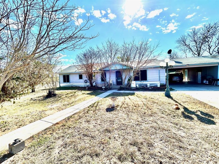 Live the quiet, country life at this attractive 3-bedroom, 2-bath home about 15 minutes from Brownwood.  The home features central heat and air, open living area, updated electrical wiring, ceiling fans, pedestal tub, a large laundry room, and a 2-car attached carport with connected multi-purpose room.  The 5.214-acre property is partially fenced and includes many established trees, a 270-sq. ft. cabin with electricity, water, bathroom, and sleeping loft, as well as a 192-sq. ft. storage building.  A stock pond at the back of property is shared with neighbor.