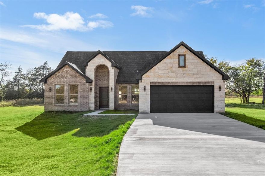 Beautiful New Build on 2.5 Acres in Barry, TX!!! Experience modern country living in this brand-new 3-bed, 2-bath home spanning 2,250 sq. ft. Nestled on 2.5 acres, this property blends luxury finishes with peaceful surroundings. Inside, you’ll find granite countertops, stunning ceramic tile floors, an electric fireplace, and striking decorative light fixtures throughout. The open-concept layout offers a spacious feel ideal for entertaining, while the primary suite provides a relaxing retreat. Enjoy refined craftsmanship and thoughtful details in every corner – the perfect combination of comfort, style, and space. TV, Barstools, and Refrigerator included.