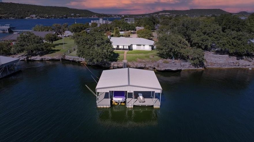 Seller willing to owner finance at 5% with proper documentation!  Prime location on deep water of 85 ft!  Discover your piece of paradise with this stunning property boasting one of the best views at PK Lake, showcasing breathtaking panoramas and tranquil waters. Nestled in a highly sought-after location, this impeccably maintained retreat ensures privacy and security with gated access. Experience comfortable living in a turnkey home featuring an updated palette, double ovens, and generous spaces ideal for relaxation. Enjoy the added benefit of short-term rentals being allowed, and your own private boat dock with a slip for your boat and space for two jet skis, making it the perfect getaway for water enthusiasts. Embrace the tranquility and beauty of lakeside living in this exceptional property! Furnishings can convey with acceptable offer.