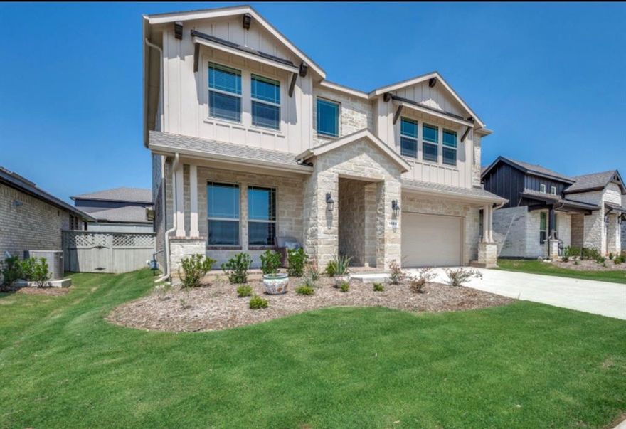 Bom due to buyer financing. Clean inspection and ready to be yours! Your Dream Home Awaits in Pecan Square community! This stunning 5-bedroom, 4-bathroom home offers modern, open-concept living with a prime neighborhood waterfront view. The thoughtfully designed floor plan features convenient in-law accommodations with a secondary bedroom and full bathroom downstairs, alongside the luxurious primary suite. The heart of the home showcases a contemporary kitchen equipped with abundant cabinetry, elegant quartz countertops, stainless steel Whirlpool appliances, a gas range and ss refrigerator that conveys. Stylish pendant lighting illuminates the spacious island, while a walk in pantry provides ample storage. The kitchen flows seamlessly into the living area, which features a cozy gas fireplace. The main floor primary bedroom serves as a private retreat, complete with a relaxing garden tub, separate shower, and generous walk in closet. Upstairs, three additional bedrooms and two full bathrooms provide comfortable accommodations, complemented by a versatile game room and loft area. This home includes a designer package with tile flooring throughout the entry, living areas, hallways, and wet spaces. Smart home technology with Home Connected + Canopy systems adds modern convenience. The covered back patio extends your living space outdoors, while the full sprinkler system, professional landscaping, and French drains ensure effortless maintenance. Easily host and entertain family and friends, while also taking advantage of the plethora of community events and amenities. Embrace resort style living with access to community pools, playgrounds, clubhouse, fitness center, and more. This active, family focused neighborhood promotes outdoor living and genuine community connections, all while overlooking scenic walking paths and charming small ponds and lakes. Washer, dryer, and refrigerator convey! This gem is the one!