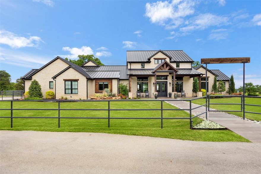 The most breathtaking view in Denton County! 20 mile views! No expense was spared on this spectacular property. The entire 6+ acre Ag exempt property is fenced in with 4 ft pipe fencing, has a 0.75-acre pond stocked in 2019 with largemouth bass with aeration pump and custom dock, 850 ft deep water well with pump for irrigation and stone well house, huge covered and paved shed, and so much more! Walking through the front door, you are greeted by warm hardwood floors, a wall of windows with the most beautiful views, and vaulted ceilings with solid cedar beams in the spacious open great room. Kitchen boasts a huge center granite island, commercial grade Signature 6 burner gas and electric range and vent, 66 inch custom built-in refrigerator (both less than 1 year old). Head out back to the backyard oasis with negative edge spa, pool with chiller and heater and in-floor cleaning system, huge covered porch with built in kitchen with grill and smoker. You can also go down to the pond and fish or sit around the firepit and watch deer in the evening. This is a special property with every luxury and complete privacy. Schedule a private showing today.