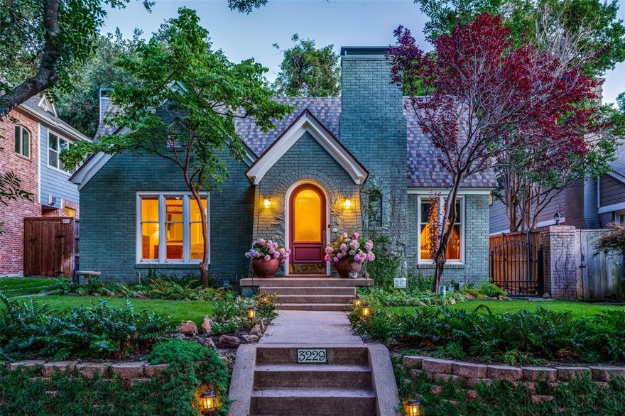 Enjoy a wonderful brick Tudor filled with 1935 architectural charm & modern amenities on a tree-lined street in University Park, walking distance to Snider Plaza, SMU, Burleson Park & acclaimed University Park Elem., Highland Park ISD. This great floor plan provides on the first floor a downstairs primary suite (with two closets & bath with separate tub and shower), formal living and dining rooms, den-family room, & half bath. The eat-in kitchen with island & custom cabinetry opens to a cheery sunroom with outdoor views of a grassy backyard. A playroom and two bedrooms with full bath are up with utility room, storage & cedar closet. Amenities in this well-maintained home include new roof (May 2024), hardwoods, pier & beam foundation, two fireplaces, newer windows, light-filled rooms, water filtr. system, & landscaped front & back yards, patio & det. two-car garage. A prime location provides convenient access to local parks with tennis & pool, bike trails, dining, shops, arts & sports.