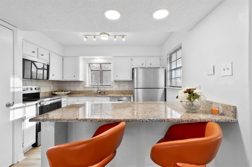 Special Financing with an acceptable offer.  This property comes with a 2-1 temporary rate buydown.  Welcome to effortless living in this updated, move-in ready 1-bedroom, 1-bath ground-floor corner unit in Preston Bend Village. This thoughtfully renovated single-story condo offers both style and convenience in a prime North Dallas location. Unit has been freshly painted in 2026. The Hot Water Heater was replaced in September 2025. Step inside to discover engineered wood in the living, dining and bedroom. Luxury Vinyl Plank was installed in kitchen and bathroom May 2025, giving the unit a fresh, modern aesthetic. The kitchen shines with granite countertops, stainless appliances including range, microwave, dishwasher and Waterdrop filtration system  (installed December 2024-January 2025), and white cabinetry, perfect for both everyday living and entertaining. The unit also has updated lighting and Nest thermostat. The spacious bedroom and updated bathroom offer comfort and privacy, making this the ideal retreat for professionals, downsizers, or anyone seeking a low-maintenance lifestyle. The covered patio features both tile flooring and turf plus a storage closet. Enjoy the ease of ground-floor access with no stairs and plenty of natural light from its corner-unit location. Outside, you're just steps away from Trader Joe’s, local cafes, and top-rated restaurants. You're also a short drive to Addison’s vibrant dining and shopping scene, and Hillcrest Village, where a beautiful central park is surrounded by even more great food and drink options. Assigned parking space #65 along with plenty of guest parking. Washer and Dryer will convey with the property.