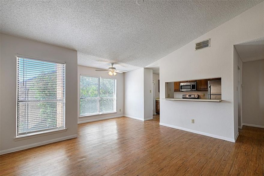 This second-floor condo puts you CLOSE TO IT ALL! AT&T Stadium, Globe Life Field, Six Flags, Hurricane Harbor, plus plenty of dining and shopping.

Inside, you’ll find a BRIGHT LAYOUT with wood-look floors and abundant natural light. The home includes SPACIOUS BEDROOMS and BATHROOMS. Sip morning coffee or have a private dinner party on your PRIVATE BALCONY, accessible from both the kitchen and primary bedroom. Enjoy having your own laundry space complete with the INCLUDED WASHER AND DRYER. Plus, the refrigerator stays too! With the HVAC only three years old, moving in is easy and stress-free. The open living and dining room layout feels spacious and opens to the kitchen. Cozy up to the wood-burning fireplace in the winter! FRESHLY PAINTED!

The Cloisters is a quiet gated community in the heart of it all with three pools, a fitness center, sauna, tennis courts, and a clubhouse. A great opportunity to enjoy comfort and convenience in the heart of Arlington at a great price!