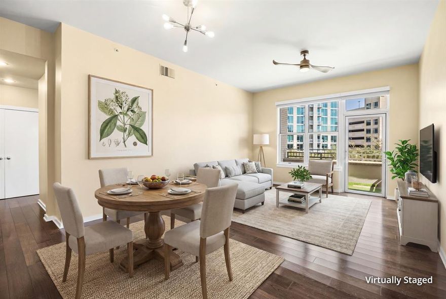 Experience refined city living at the luxury mid-rise Terrace Condos in the heart of Victory Park. Premier location within walking distance to the American Airlines Center, Perot Museum, Kyle Warren Park, Katy Trail, top tier restaurants, and the coming soon Goldman Sachs campus with a 1.5 acre urban park. Spacious and thoughtfully designed 2 bedroom, 2 bath unit with 10 ft ceilings, hardwood flooring, expansive windows with dual layer shades. Kitchen updates include modern flat panel cabinets, quartz countertops, GE Profile stainless steel appliances, and new Samsung refrigerator. HVAC and dishwasher replaced in 2025. Private terrace showcasing scenic skyline views of downtown Dallas and the House of Blues. Resort style HOA amenities include on-site concierge, 24 hour security, fully equipped fitness center, social lounge, heated pool with amenity deck and outdoor fireplace. Two assigned, gated garage parking spots.