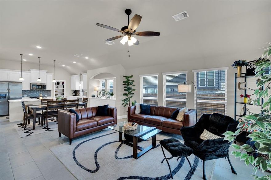 Stunning Bloomfield Homes Hawthorn plan, a nearly new, meticulously maintained single story beauty designed for bright, open living & effortless style. From the moment you step through the custom 8’ front door, you’re greeted by a dramatic octagonal foyer with curved walls, art niches, & glass French doors in Study, perfect for working from home or second living area. The heart of the home shines with an open-concept layout, soaring ceilings, & abundant natural light pouring through large strategically placed Low E windows. Ceramic tile flooring flows through all main areas, complementing the crisp quartz countertops & painted cabinetry. The chef-inspired kitchen features stainless steel appliances, an oversized island with designer pendant lighting, a walk-in pantry, & built in butler’s pantry for added storage & serving space, ideal for entertaining. Expansive Owner’s Suite is a true retreat, highlighted by a large bedroom & an upgraded bath featuring an enlarged shower, dual sinks & quartz countertops. Three additional secondary bedrooms are thoughtfully split from the primary suite, offering privacy for family or guests. Extended covered patio, complete with a ceiling fan & upgraded lighting, making it the perfect spot to unwind or host gatherings. The exterior showcases upgraded white brick with beautiful stone accents & a 2.5-car extended garage, adding the extra storage or workspace every homeowner appreciates. Refrigerator, washer & dryer convey. Easy compute to DFW & both airports.