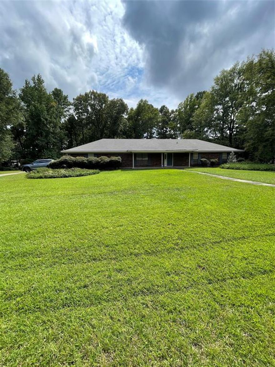 Spacious home with large yard in very nice neighborhood. Easy access to major highway (175).  Out of Mansfield city limits, but minutes away.  Easy access to shopping, restaurants via I-49.  Four nice sized bedrooms with large closets, large living room, large den with fireplace with insert, built in shelving.  Small wet bar is hidden discreetly in the den.  Corner lot with much room for gardening and outside activities.  Out-building in the back is functional.  Heated square footage is estimated but believed to be true.  Buyer is responsible to confirm actual footage.  Home has been cared for, with HVAC serviced semi-annually.  Home water filtering system is in place.  Washer and dryer hook ups are in a hall closet, close to all bedrooms.  You need to see this to appreciate it!  Lots of storage, lots of room!!!  SO much room, inside and out!!