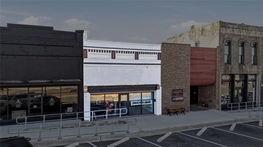 Positioned in the heart of historic downtown Whitesboro, 108 E Main Street offers a rare opportunity to own an income-producing commercial asset designed specifically for today’s entrepreneurs. This 2,400 square foot office suite has been thoughtfully configured into 10 individual office spaces plus a welcoming common-waiting area, creating a highly functional layout that serves a strong and consistent demand for smaller, professional workspaces in the Whitesboro market. This property fills a unique niche for local business owners who need quaint, affordable office space without the overhead of a larger commercial lease. Several long-term tenants are already in place, making this a true cash-flowing investment from day one. Two of the suites feature direct storefront exposure on Main Street, providing additional visibility and branding opportunities for tenants who benefit from walk-in traffic and downtown exposure. Each individual office is equipped with running water, allowing for a sink installation if desired—an attractive feature for service-based professionals. Tenants share a well-maintained common restroom, and the shared commons area offers a comfortable waiting space for clients and customers. The interiors have been tastefully updated and are well cared for, offering a professional environment that reflects pride of ownership. Access and security have been carefully considered, with an electronic keypad entry system for business owners and video surveillance equipment installed for added peace of mind. Ample public parking is available along Main Street for clients, while alley access provides additional rear parking convenience for tenants. 108 E Main Street represents a stable, income-producing opportunity in a growing downtown corridor—an ideal investment for anyone looking to own a well-maintained commercial property that supports and serves the entrepreneurial community of Whitesboro.