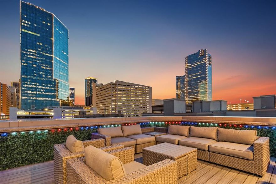 Welcome to 409 E 7th Street, a rare opportunity in the architecturally significant Le Bijou enclave, just one block from Sundance Square, Bass Hall, and downtown Fort Worth’s best restaurants, nightlife, and culture. Corner unit designed by Schaumburg Architects and fully renovated from 2021 to 2025, this luxury townhome combines classic design, bold modern finishes, and every convenience of high-performance urban living. 
Step through double iron doors into a flexible first-floor space perfect for a gym, office, or lounge. Take the private elevator or stairs to open-concept living and dining areas with soaring ceilings, refinished hardwood floors, and oversized windows that flood the space with natural light. The chef’s kitchen is a true centerpiece, featuring quartz countertops, soft-close cabinetry, a massive island with seating, and top-of-the-line Viking appliances including a 48-in range, built-in fridge and wine coolers. Upstairs, the primary suite is your sanctuary, with a spa-inspired bath, jetted tub, walk-in shower, quartz surfaces, and a large custom closet. Throughout the home, enjoy multiple fireplaces, wood shutters, motorized shades, and Sonos-based audio, with smart home wiring and WiFi-enabled thermostats. 
The crown jewel? A fully decked-out rooftop terrace with unmatched views of the Fort Worth skyline (video available). Think: Trex decking, Blaze grill, outdoor kitchen with dual refrigerators, prep station, ice machine, gas fireplace, natural stone surfaces with custom LED lighting, built-in heaters, two TVs, a six-person jetted hot tub, and a covered dining area. Whether it’s game night , sunsets or sunrises, this rooftop delivers. Extras? epoxy-finished 3-car garage, commercial roof, recent HVAC, Pella windows, fire protection system, and retractable wind and sun screens. This is the ultimate retreat, lock-and-leave luxury.