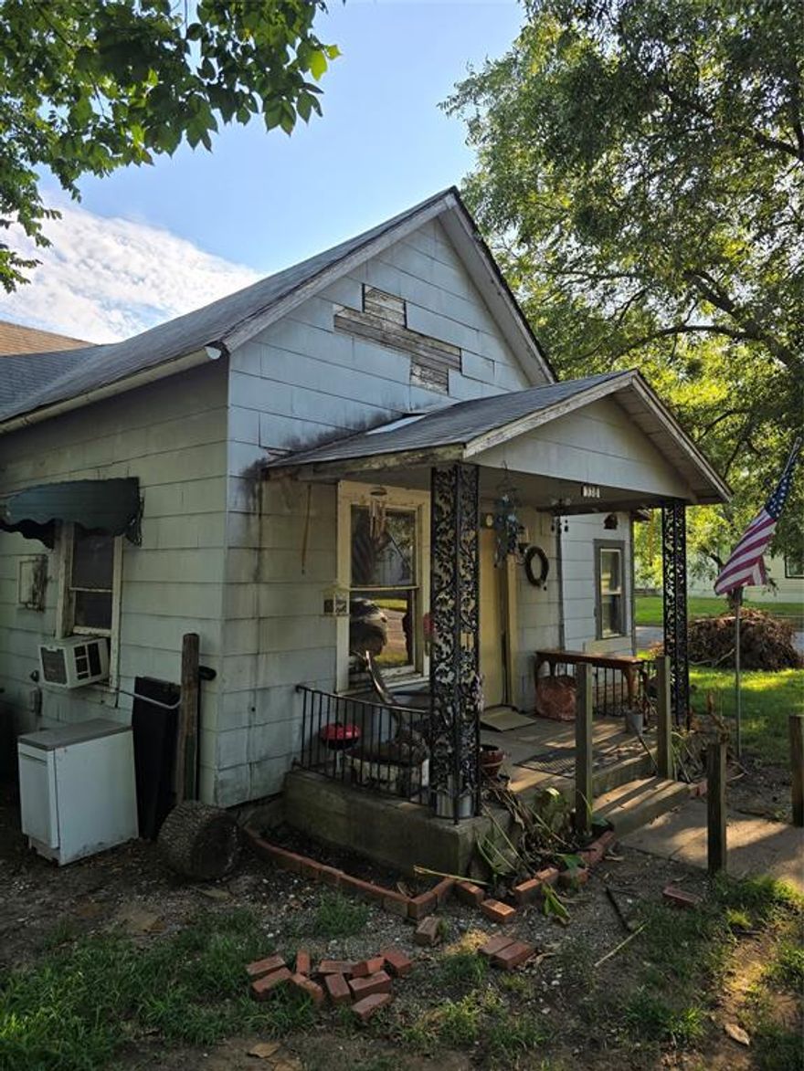 Investor,  Handy-person, here is your next project.  This 2 bed 1 bath home is located on a large corner lot with fenced back yard, and offers plenty of potential for real estate investment or personal use. Several homes in the area have been rebuilt or renovated, so this quiet 1930s neighborhood could be just right for you.