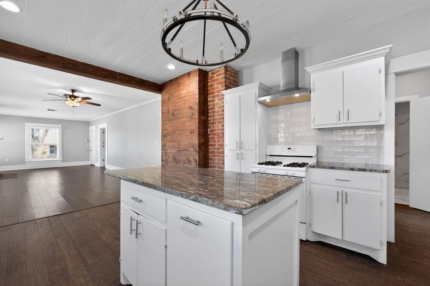 Historic charm meets modern luxury! Step into this stunningly remodeled 1925 craftsman-style home located in the heart of Waco's beautiful Huaco Heights. Spanning 1388 sq ft, this 3-bed, 2-bath gem perfectly balances its original character with sleek, contemporary upgrades. The heart of the home is the gourmet kitchen, featuring stunning granite countertops, elegant brass hardware, and a high-efficiency tankless water heater. Cozy up by the classic brick wood-burning fireplace in the spacious living room, or retreat to the primary suite that boasts designer lighting and modern finishes. Outside, enjoy a private backyard sanctuary with a detached garage and plenty of room for gardening or weekend BBQs. Located just minutes from Magnolia Market, local parks, and Baylor University, this fully updated home is a rare find that captures the true spirit of Waco. Come see it today!