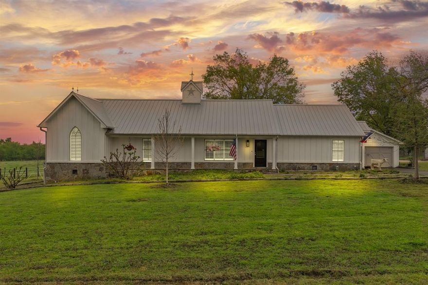 A collector's dream comes true with this farmhouse chic 2,756 square foot home, on 16-plus acres, with custom touches and tastefully hand-picked antique finishes! From the elegant 1860's Georgia wood floors and antique Chicago pavers, walk into this handsome home and be astounded by the thoughtful interior decorating that elevates the space. Barn beams from the 1840's give the vaulted ceilings a nice pop of warmth in the living room, kitchen, and dining areas. Skylights, white slat ceilings, and recessed lights also brighten up the great room. A generous kitchen includes a commercial gas range, warming tray with heat lamps, commercial vent, farm sink, dishwasher, separate ice maker by the pantry, and custom lights. The walk-in pantry comes with an antique door. The primary ensuite bedroom will impress with a spa-like bathroom that has a luxurious interior with a separate tiled shower, soaking tub, and separate double sinks. Guests will enjoy the spare bedroom with a modern hall bathroom with a tiled walk-in shower. A second living space will make the perfect family room or can be turned into a bedroom. Additional touches include custom-made Gothic window, Kohler faucets, plantation blinds from Custom Shutters, GE monogram appliances, restoration hardware vanities with solid surface Caesar Stone tops, handmade walnut doors, and handmade cupola. Sit on the oversized 1,009 square-foot deck and appreciate the mature trees that were planted in the fall of 2024. Parking is a breeze with a concrete drive and 600 square-foot garage. This house also comes with Prierfert Ponderosa fencing, spray foam in the attic and pier and beam areas, and large scenic pond. This spectacular place provides lots of curb appeal, including Copper Bevolo gas lanterns from New Orleans--all with acreage close to town. Don't let the 1940 year built fool you. The original home was re-built and 1500 feet added by a true craftsman, master carpenter!