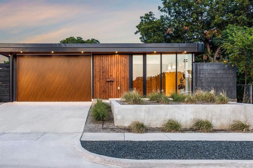 This mid-century inspired, modern home looks like it should be on the cover of a Palm Springs Visitors Guide. Sexy as hell, this architecturally significant home was imagined by OBJEKT, a Josh Nimmo architectural firm & is all about the curves (come see it to believe it). This iconic one story perches high on its lot - as it should. Framing the home, an elevated front yard separates the home from the rest of the world. A horizontal rolling garage door provides a floor-to-ceiling opening not possible on a conventional garage setup. Upon entry through the 9' tall front glazing visitors are met by a vertically slatted paneled partition (VSPP) that doubles as coat closet and storage. Inside, the living areas stack on each other building anticipation to the view of the courtyard pool wrapped by an Ipe deck. The kitchen is a simple island w the majority of the appliances and pantry hidden from plain sight behind a VSPP cabinet. Curve around the pool to access the private spaces of the home, each with an on-suite bath. A back office-bedroom overlooks another outdoor space in brilliant green and is the perfect space to focus. The master overlooks the pool, as one would expect, and provides a wet area, work area (double sinks w natural light) & custom closets with doors. DWELL where it matters, because it is YOUR LIFE and you GOT THIS!!!