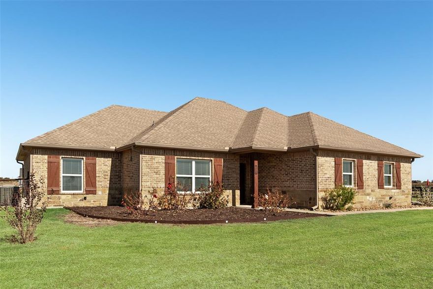 MUST SEE IN PERSON! This beautiful home has no HOA, no MUD, no PID, NO CITY TAXES, just outside city limits. This 4-bedroom, 2-bath brick & stone beauty perfectly set on a corner 1 acre lot in a highly rated school district. Located on peaceful county road with pipe fencing enclosing the entire backyard. Step inside and fall in love with the open-concept floorplan, where the kitchen flows seamlessly into the family room, centered around a cozy wood burning fireplace. The split-bedroom layout provides comfort and privacy, while the spacious utility room offers abundant storage and cabinet space. The primary suite en-suite bath offers a double-vanity bath with jetted tub, separate tile shower, and a walk-in closet. Unwind under the covered back patio as you take in the breathtaking Texas sunsets, the perfect backdrop for grilling, entertaining, or simply relaxing. In addition, the home has a side entry two car garage and long driveway. This property offers everything you’ve been searching for: acreage, charm, and convenience all wrapped up in one beautiful package. AND Frontier high speed internet available.