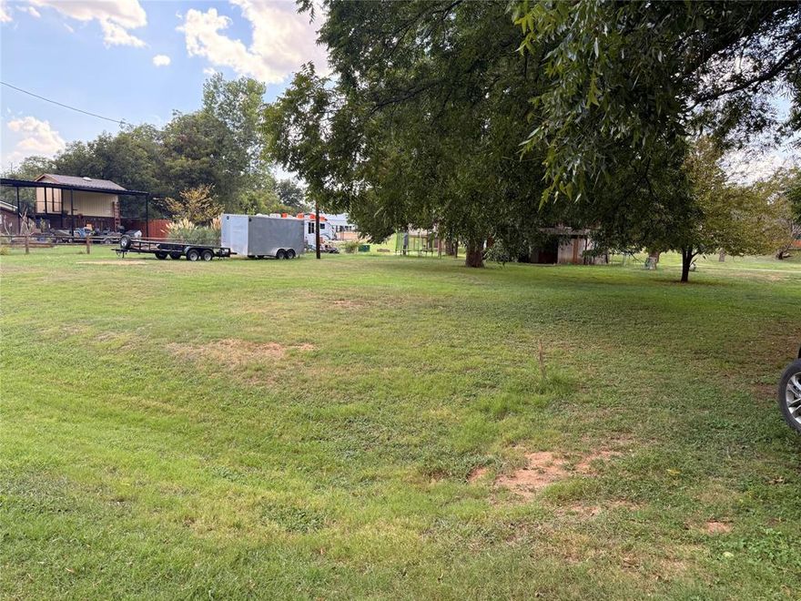 2 Lots included in this property, just across from the Brazos River, ready for your use!  Use for a summer or weekend retreat with your RV, or build to suit.  Mobile homes allowed.  Wide range of opportunities for use!  The community has a boat ramp for residents, golf course, pool, clubhouse with restaurant & other amenities available.