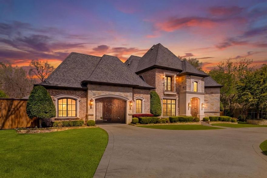 Set discreetly along 4719 Forest Lane in the heart of the coveted Private School Corridor, this French Country estate is an elegant study in refinement, where classic European inspiration meets the ease of modern Texas living. Framed by mature trees and lush, manicured grounds, the property unfolds with a quiet sense of grandeur behind a gated approach and porte-cochère, offering both privacy and presence.

Inside, the atmosphere is one of effortless sophistication. Sunlight filters across vaulted ceilings, illuminating rich natural woodwork, tailored paneling, and a curated mix of decorative lighting and statement chandeliers. The architecture reveals itself gradually—multiple staircases, intimate alcoves, and expansive living spaces designed for both large-scale entertaining and quiet, everyday luxury.

At the heart of the home, the kitchen is as functional as it is beautiful. Anchored by a generous island, it is outfitted with professional-grade appliances including a gas range, double ovens, warming drawer, and built-in refrigeration—equally suited for morning rituals or evening gatherings. 
Private quarters offer a serene retreat, where spa-like baths, double vanities, and spacious walk-in closets evoke a boutique hotel sensibility. Every space has been considered, every finish intentionally chosen.
Outdoors, the estate transforms into a resort-inspired escape. A tranquil courtyard, covered terraces, and a balcony overlooking the grounds invite moments of pause, while the expansive backyard offers a rare combination of leisure and play—from a private putting green to a playground and dedicated dog run. Even the most practical elements—an electric gate, epoxy-finished garages, and thoughtfully designed utility spaces—are executed with precision.

This is more than a residence; it is a lifestyle defined by elegance, comfort, and distinction—an exceptional offering in one of the city’s most prestigious enclaves.