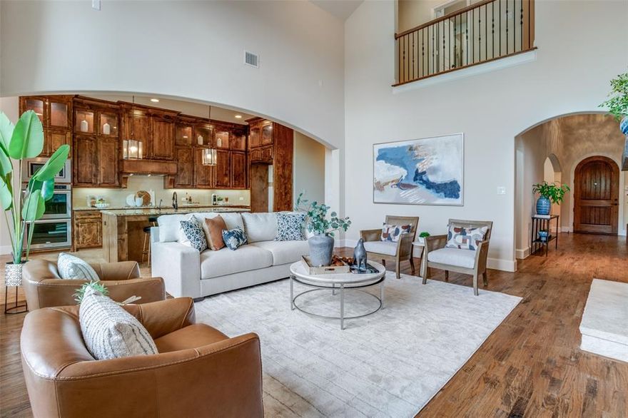 Love to cook and entertain? Want a great location with good schools? This Custom-Built Southgate Stunner in the Heart of Allen is home to two kitchens! Experience timeless elegance and thoughtful design in this home, where luxury meets functionality. Nestled in a desirable Allen neighborhood with convenient access to Central Expressway, 121, dining, and shopping, this impressive residence is loaded with upgrades and ready to welcome you home. The two kitchens are amazing - a gourmet main kitchen featuring an oversized island, double ovens, walk-in pantry, beautifully lit cabinetry, and a seamless flow into the living and dining spaces. The secondary chef’s kitchen is fully equipped with a six-burner cooktop, vent hood, sink, fridge space, and private door -  both are perfect for meal prep or hosting large gatherings. The main living area is breathtaking with its vaulted ceilings accented by wood beams, expansive wall of windows, cozy fireplace, built-in cabinet, and rich hardwood floors. The luxurious primary suite offers a spa-inspired bath and two spacious closets, one with a convenient pass-through to the laundry room. A private guest suite with en suite bath, a dedicated home office, and a formal dining room with butler’s pantry complete the well-planned first floor. Upstairs, each secondary bedroom features its own en suite bath, including one oversized bedroom that could easily serve as a second primary suite. The game room with wet bar and media room create the perfect hub for entertaining or family nights in. Step outside to a blank-slate backyard and patio ready for your personal touch, whether it’s a pool, garden, or outdoor kitchen. Additional features include clay tile roof, oversized garages ideal for larger vehicles, whole-home water softener, 6-stage reverse osmosis water purifier, ample storage and smart organization throughout. This home is a rare opportunity to own a beautifully upgraded, functional, and stylish property