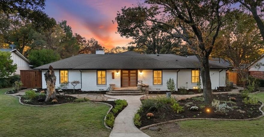 OPEN HOUSE, SUNDAY 2-4PM! Exceptionally renovated and truly magazine-worthy, this mid-century modern 3,728 SF residence is a rare find. Located at 7736 Woodstone Lane in the highly sought-after Spring Creek subdivision of Far North Dallas, this stunning home offers 5 bedrooms plus an office, 3.5 baths, a 2-car garage with an oversized 6-car driveway, and sits on a private 0.32-acre lot. Thoughtfully redesigned in 2025 with top-tier finishes and modern upgrades, this family home blends style, function, and comfort at every turn. Step inside to an open-concept layout featuring a cozy fireplace with Venetian plaster surround, vaulted ceilings with beautiful exposed beams, a chic wet bar, designer lighting, and seamless flow between the living, dining, and kitchen areas. The gourmet kitchen is a true showpiece, offering expansive custom-built white oak inset-style cabinetry, quartz countertops with dolomite backsplash, a 10-ft eat-in island, and all-new premium SS appliances. The spacious primary suite includes a large walk-in closet and a stunning ensuite bathroom featuring Bedrosians and terrazzo tile, a standalone soaking tub, an oversized double-rain shower, and a dual vanity. Two additional bedrooms share a beautifully upgraded Jack-and-Jill bath with a walk-in shower, while two more bedrooms share a sleek hall bathroom with a tub, ideal for guests and conveniently located near the kitchen area. A spacious office is positioned near the front entry. Beautiful engineered white oak hardwood flooring flows throughout the home, complemented by designer tile in the baths. Step outside to a private and spacious backyard featuring lush landscaping, new sod, a pergola, and an outdoor kitchen, perfect for relaxing or entertaining. Conveniently located near premier shopping, dining, and entertainment with quick access to major highways (PGBT, DNT, 75 and 635), this home offers exceptional convenience to all your favorite Dallas destinations. Schedule your tour today.