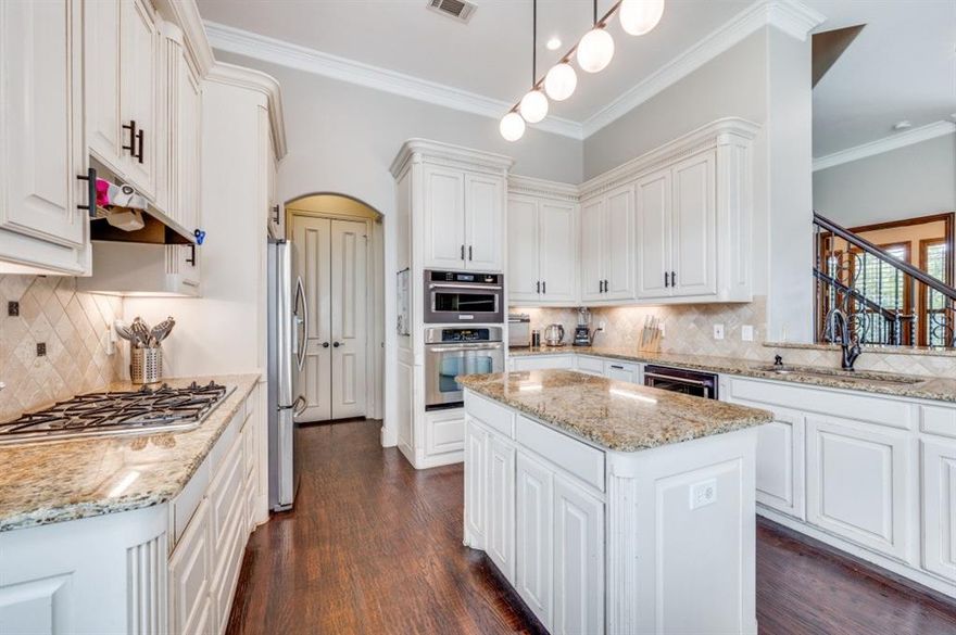 Welcome to this extraordinary 3 bedroom, 4 bath home with office and bonus loft nestled in the highly sought-after, gated community of University Park.  This meticulously designed residence offers an unparalleled combination of comfort, luxury, and sophistication, all within a secure and exclusive neighborhood.  From the moment you step inside, you are greeted by a grand foyer with souring ceilings and exquisite finishes.  The open-concept layout flows seamlessly from the formal living areas to the gourmet kitchen, making this home perfect for both entertaining and everyday living.  The chef's kitchen is equipped with top-of-the-line appliances, custom cabinetry, a large center island, and a spacious breakfast nook, ideal for hosting intimate meals or large gatherings.  Each of the 3 bedrooms is generously sized offering ample closet space and natural light.  The primary suite is a true retreat, with a spa-like bath and massive walk-in closet.  Bonus loft area attached currently used as a nursery.  One of the standout features of this home is the INCREDIBLE MAN CAVE-a true masterpiece for relaxation and entertainment.  Whether you are watching the big game, hosting a poker night, playing pool or enjoying a quiet evening with friends, this space is unparalleled;  with high-end finishes, a built-in wet bar, surround sound & custom lighting, it's the ultimate retreat and the envy of the neighborhood.  Other highlights include formal dining room, a gorgeous home office with walls of built in bookcases & drawers. Private backyard with ample space for outdoor living and dining.  The community itself provides residents with exclusive amenities such as private parks, walking trails and 24-hour security.  Located minutes from major highways, shopping, dining and entertainment. Don't miss the opportunity to own this one-of-a-kind property in the heart of Irving. Brand new hot water heater, high end epoxy garage floor, newer paint & air conditioning plus many custom features.