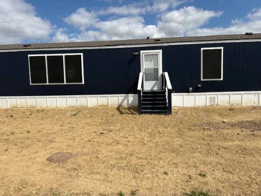 Situated on 3.71 acres along a private road, this 2022 manufactured home offers space, privacy, and comfort. The home features 3 bedrooms, 2 bathrooms, and approximately 2,358 square feet of living space with an open layout designed for everyday living and entertaining. Step outside to enjoy the large, covered deck, perfect for relaxing, entertaining, or taking in the peaceful country surroundings. With plenty of room to spread out and enjoy the outdoors, this property offers the ideal combination of modern living and quiet rural setting.