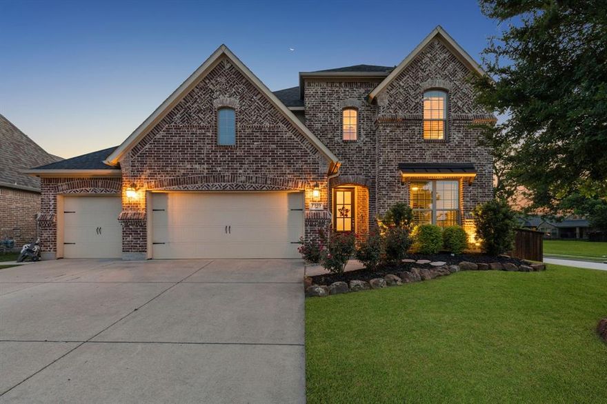 Welcome to this stunning modern home in the highly sought-after Trinity Falls community, nestled on a rare corner cul-de-sac lot adjacent to a lush greenbelt. From the moment you step inside, soaring 18-foot ceilings, spiral staircase, rich hardwood floors, and a dramatic floor-to-ceiling stone fireplace set the tone for the designer-curated upgrades found throughout. The open-concept layout seamlessly connects the living, dining, and kitchen spaces — ideal for entertaining. The chef's kitchen impresses with marble countertops, a glass tile backsplash, stainless steel appliances, and a 5-burner gas cooktop. The main floor also features a spacious primary suite with a luxurious en suite bath and walk in closet, plus a private guest bedroom downstairs with its own full bathroom. Upstairs, enjoy a game room, media room, and generously sized secondary bedrooms. Plantation shutters and motorized blinds add a polished finishing touch throughout. Step outside and enter your own private oasis — a breathtaking backyard retreat designed for those who love to live and entertain outdoors. The resort-style pool stuns with elegant fire bowls and a cascading waterfall! Putting green, full outdoor kitchen, and covered patio with a cozy fire pit complete a backyard that truly has it all. Fresh landscaping and new luxury tile around the pool. Privacy fencing ensures the space feels like an exclusive escape, no matter the occasion. Don't overlook the extensive attic storage and the 3-car garage with upgraded epoxy flooring. As a Trinity Falls resident, you'll also enjoy community amenities including a beach-entry pool, splash pad, playgrounds, dog park, fitness center, and scenic hike and bike trails.