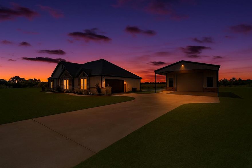 This stunning custom built home combines luxury, modern design, and country tranquility. Featuring a spacious open-concept floorplan with soaring cathedral ceilings, exposed wood beams, and a striking quartz stone fireplace, this residence is perfect for both entertaining and everyday living. The luxurious master suite offers a spa-like retreat with a frameless glass shower, sleek modern tile, dual quartz vanities, and an enormous built-in closet with ample storage. The gourmet kitchen impresses with a walk-in pantry, shaker cabinets extending to the ceiling with glass upper cabinets, backlit lighting, elegant quartz countertops, and a stylish backsplash, ideal for culinary enthusiasts. Situated on just over an acre, this property provides a serene country setting with mature trees, plenty of room for kids and pets to play, family gatherings, or relaxing on the huge covered patio. The property also includes a 30x50 electric workshop – perfect for hobbies, projects, or additional storage. Built with energy efficiency in mind, the home features encapsulating foam insulation and rests on a durable pier & slab foundation, ensuring long-lasting comfort and quality. Experience the perfect blend of modern farmhouse elegance, luxury, and peaceful country living.