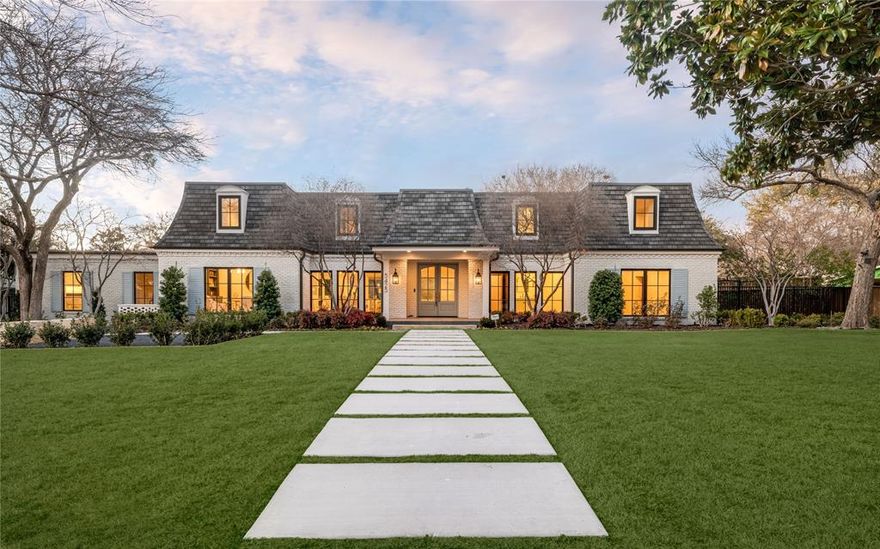Beautifully reimagined and thoughtfully executed, this exceptional five-bedroom home with optional sixth bedroom or flex space rests on a lush half-acre in coveted Russwood Acres — one of Dallas’ most established and desirable neighborhoods known for mature trees, generous lots, and timeless architecture. Extensive design upgrades and system improvements create a residence that balances elegance with everyday comfort.
A welcoming courtyard and gated drive set the tone for refined living. Inside, rift-cut red oak floors, custom millwork, and abundant natural light enhance open living spaces anchored by a limestone-mantel fireplace and expansive sliding doors leading to the covered patio — ideal for seamless indoor-outdoor entertaining.
The chef’s kitchen features custom white oak cabinetry, quartzite surfaces, professional Thermador appliances, wine refrigeration, ice maker, and a functional working pantry, all flowing naturally into the main gathering areas.
The primary suite offers a peaceful retreat with coffered ceiling detail, patio access, and a spa-inspired bath with quartzite countertops, soaking tub, oversized shower, and custom walk-in closet. A first-floor guest suite, dedicated study, and mudroom add flexibility.
Upstairs are three additional bedrooms, renovated baths, a spacious game room with AV wiring, walk-in storage, and a versatile flex room suitable as a sixth bedroom, fitness space, or secondary office.
Major updates include HVAC, electrical and plumbing infrastructure, insulated crawlspace, recirculating hot water, and integrated audio wiring. Outdoors, enjoy an oversized covered patio with skylights, built-in grill, mature landscaping, gated parking, and ample space for a future pool.
A carefully curated transformation offering timeless design, modern comfort, and exceptional livability in a premier Dallas location.