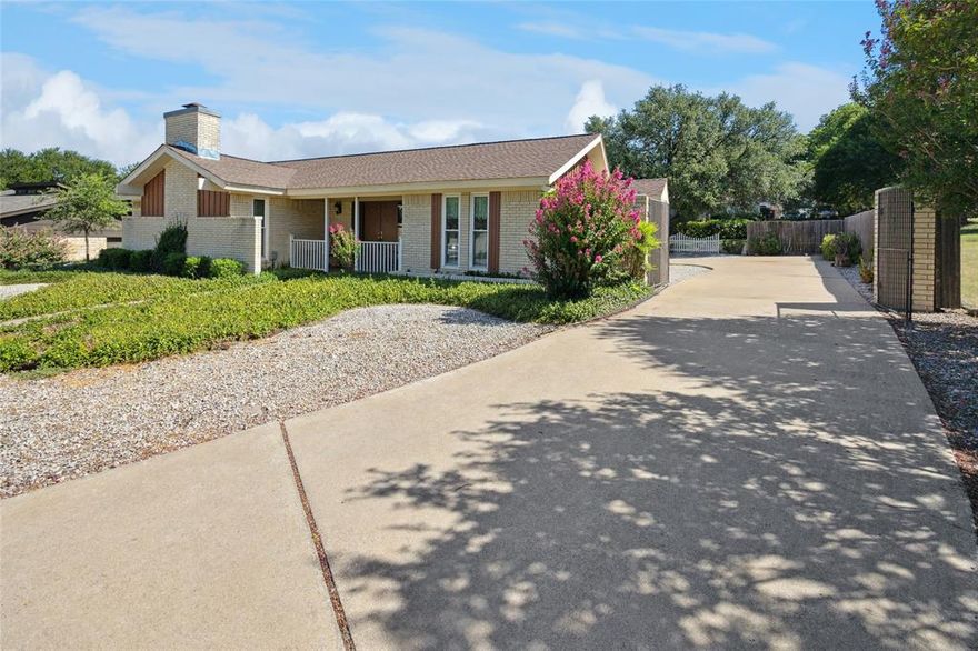 Custom one-story brick home tucked at the end of a quiet cul-de-sac, adjacent to two greenbelts—offering privacy and scenic views. This unique floorplan features a central courtyard surrounded by interior rooms, bringing in natural light and a serene connection to nature.
The spacious kitchen includes granite countertops, tile backsplash, abundant cabinet and counter space, and a cozy breakfast nook. Ideal for entertaining, the home offers two living areas—each with gas log fireplaces—separated by a wet bar.
The split-bedroom layout includes a private primary suite with dual vanities, an updated walk-in shower, dual closets, and additional storage. One secondary bedroom opens to a full bath, while another bedroom on the opposite side of the home also has direct bath access—ideal for guests or multi-generational living. Enjoy a covered back patio overlooking one of the two adjacent greenbelts. 
Located near Eagle Mountain Lake, this home is part of a voluntary POA offering access to a private boat ramp, waterfront park, playground, pickleball courts, and greenbelts. Community events include festive Christmas and 4th of July parades, food truck nights, youth fishing tournament and more.