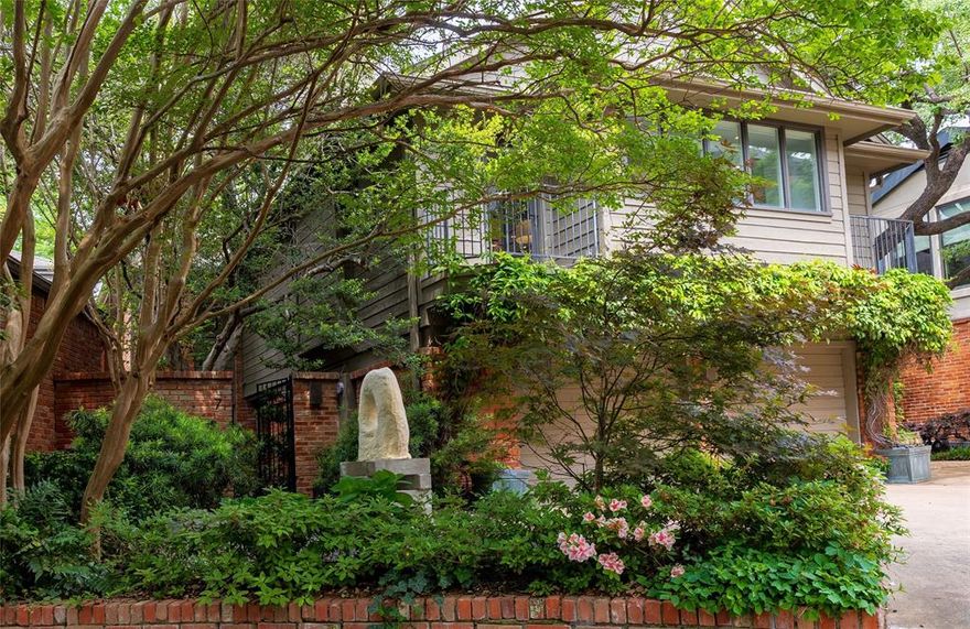 In a private enclave along Turtle Creek immediately adjacent to Highland Park, is Turtle Creek Bend, a cul de sac of 19 single family homes.  A number of these homes enjoy magical views of Turtle Creek including 7 Turtle Creek Bend.  There is much to recommend here.  Besides verdant views of Turtle Creek and being one of Dallas’ most walkable neighborhoods, it has been elegantly updated.  Award winning architect, Russell Buchanan, was tapped to rethink the original design.  Updates include two, up-to-the-minute baths, the primary bedroom suite bath being completed this year.  In the open concept kitchen, stainless steel appliances have been installed, including a built-in Miele refrigerator-freezer.  Floor-to-ceiling windows, with electronically operated window shades, frame the home’s outstanding views, and museum-finish walls and recessed lighting enhance gallery-like living spaces for an art filled home.  The property is entered via a lushly planted, courtyard.  The two-story volume living room, with floor-to-ceiling windows, has breathtaking views of the creek.  On the second floor, the primary bedroom suite, has more wonderful views.  The suite features a second room with floor length windows giving the space a treehouse feeling!  The current owner uses the room as their art studio.  The primary suite bath was taken down to the studs and includes double vanities, a Japanese style steeping tub, a separate, glass enclosed shower and marble and walnut finishes.  An unexpected bonus is the huge family room.  This multi-purpose room has a fireplace and can be used as a third bedroom.  Two additional walk-in storage closets on the second floor as well as a large utility room, make the property an A+ candidate for someone moving from a larger home.  If you have been looking for a stylish, move-in condition, single family home in the Turtle Creek corridor, you must see 7 Turtle Creek Bend.