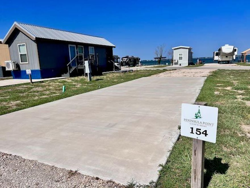 *MOTIVATED SELLER* Off-Water Lot with Views of Richland Chambers Lake! Lot 154 is located inside Peninsula Point; Peninsula Point is a gated community that has underground utilities, a central water system, private sewer and paved roads. The private, resort-style pool will keep you cool on long, hot summer days; The clubhouse has laundry facilities for your use, a boat ramp and pier for owners enjoyment! This pull-through lot will make setting up your RV a breeze with a concrete pad already in place! This friendly community is short term rental friendly and even offers an on-site management service. What are you waiting for? Grab your camper, fifth wheel, boat and jetskis and get to enjoying your new lakeside retreat!