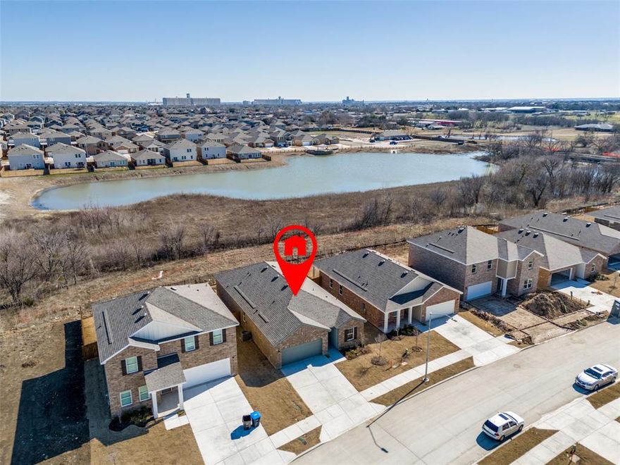 Like New Construction Home built in 2025.  The only one story 4 BEDROOM 3 FULL BATH home with a LAKE VIEW in the Ranch at Duck Creek.  Triple split floor plan.  OPEN KITCHEN plan overlooking large living dining area. Granite island counter centers this functional kitchen with pantry.  STAINLESS STEEL REFRIGERATOR, WASHER & DRYER included.  BBQ GRILL in your covered patio with a SCENIC LAKE VIEW.  Window blinds, screens, & auto garage door opener included.  Make this your new home now!